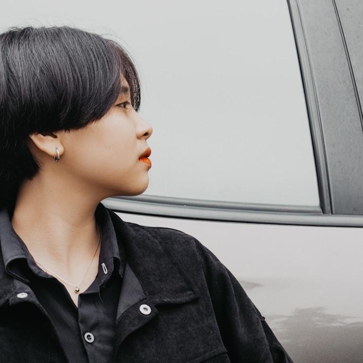 Kaveri Mehta, Lead Design Curator at MeadowPathway, reviewing corporate floral arrangements